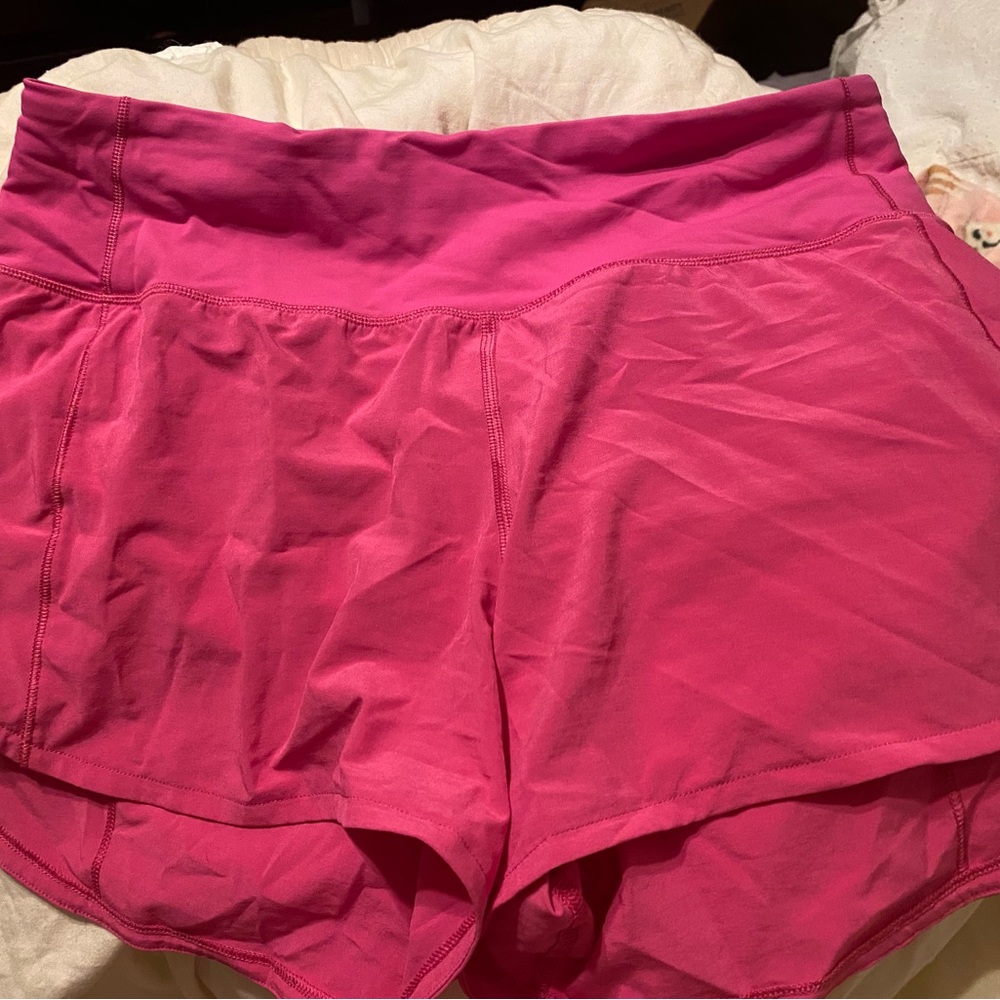 Sonic pink Lululemon mid rise 4 inch short